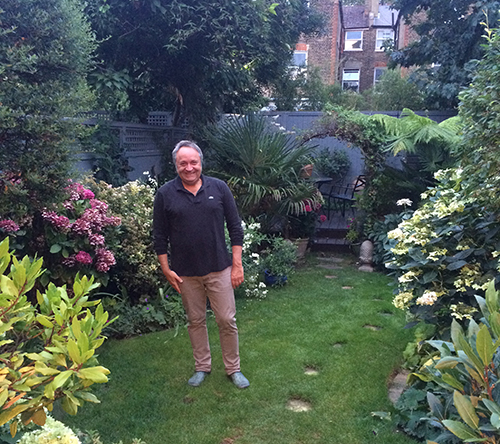 Hedgehog Champion Michel Birkenwald in his London garden